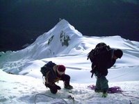 Eliseo Hammering Down an Ice Anchor